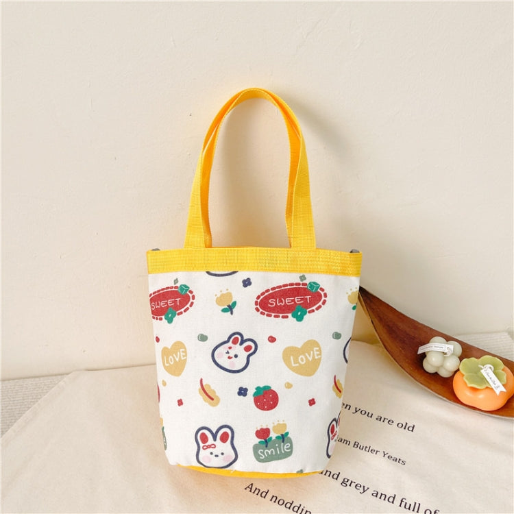Children's cute cartoon canvas bag in vibrant colors, designed for kids to carry toys and snacks comfortably.