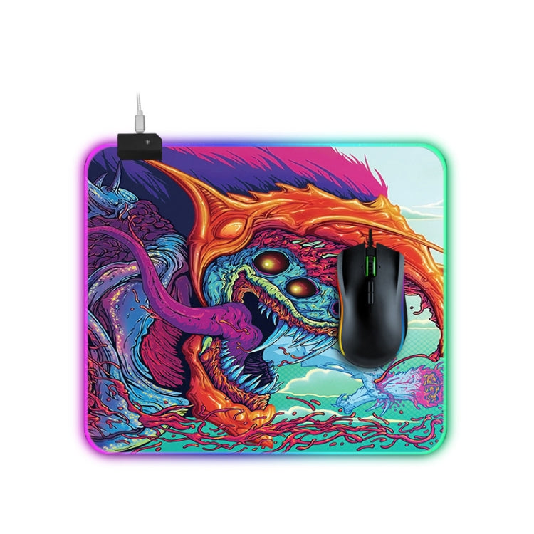Computer Monster Pattern Illuminated Mouse Pad with vibrant colors and non-slip rubber base, ideal for gaming.