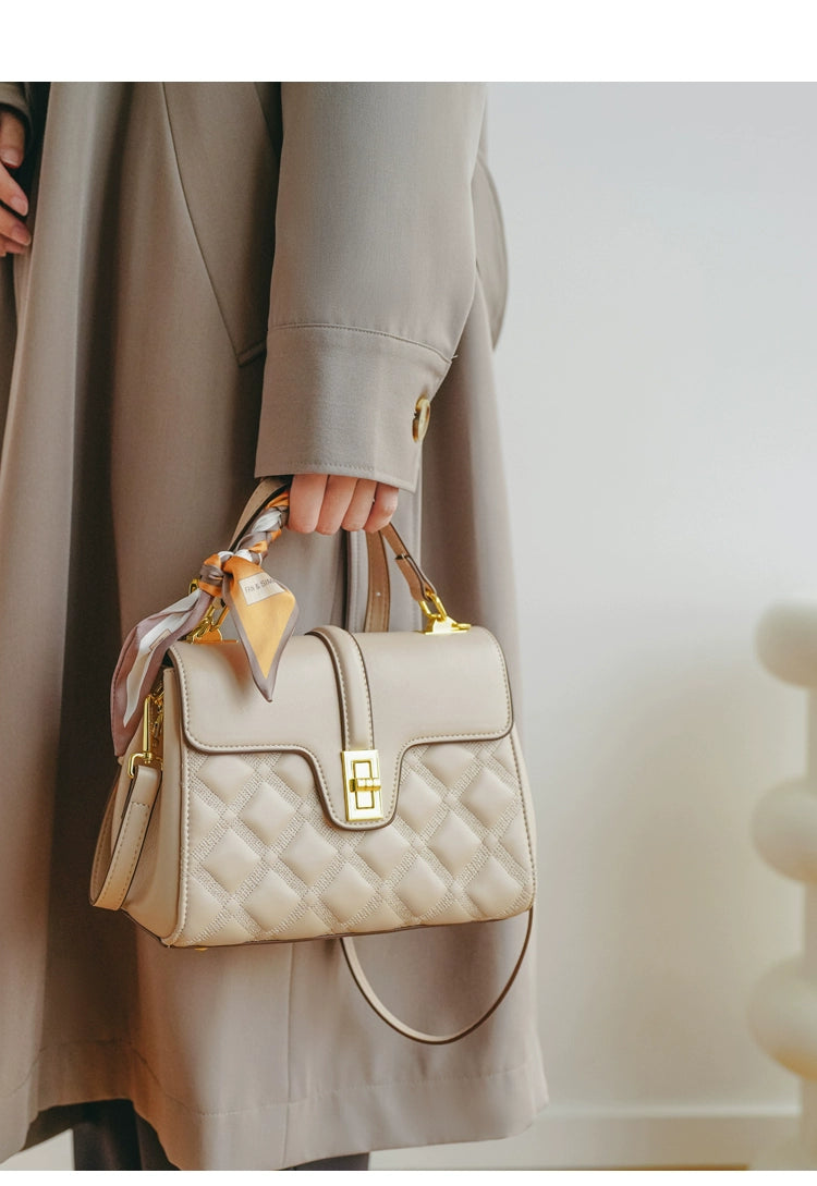 A stylish Commuter Women's Bag in a minimalist design, showcasing its large capacity and crossbody functionality, perfect for moms on the go.