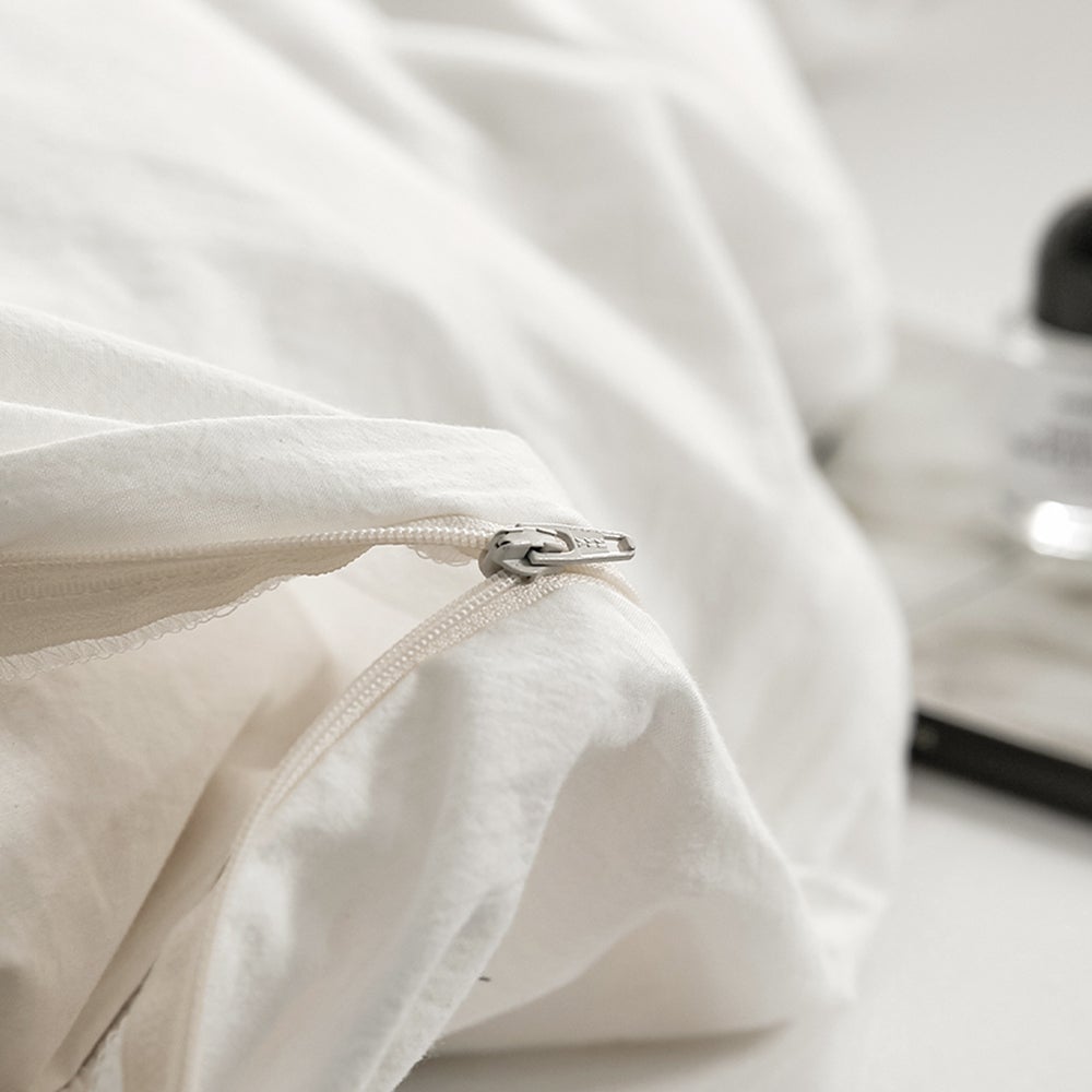 Cosy Club Duvet Cover Quilt Set in essential white, featuring soft washed cotton fabric and two matching pillowcases.