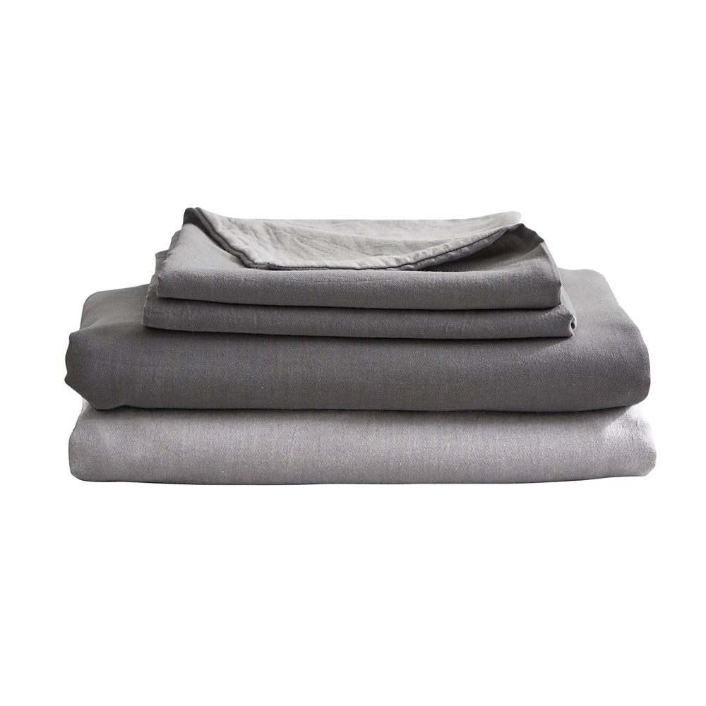 Cosy Club Sheet Set in grey, featuring a flat sheet, fitted sheet, and two pillow cases made from 100% washed cotton.