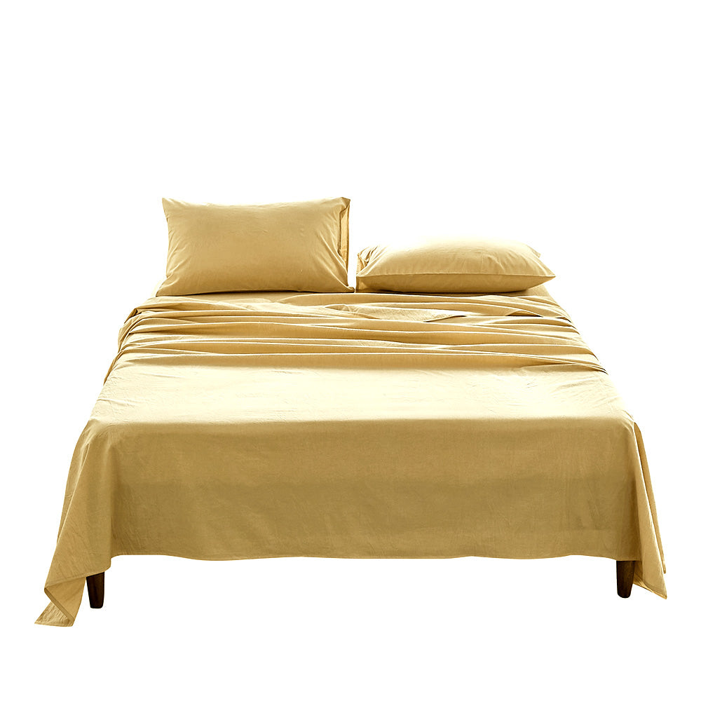 Cosy Club Sheet Set in yellow, featuring a flat sheet, fitted sheet, and pillow cases made from soft washed cotton.