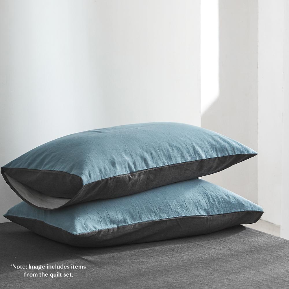 Cosy Club Dark Blue Cotton Sheet Set displayed on a neatly made bed, showcasing its soft texture and elegant two-tone design.