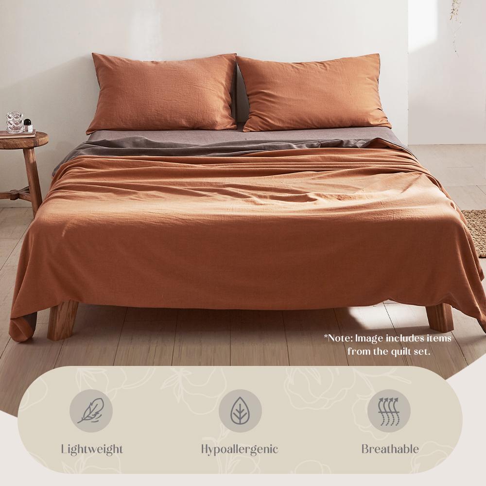 Cosy Club Cotton Sheet Set in orange brown, featuring a soft texture and two-tone design, perfect for a cozy bedroom.