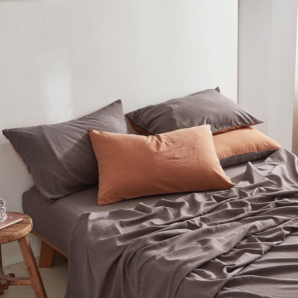 Cosy Club Cotton Sheet Set in orange brown, featuring a soft texture and two-tone design, perfect for a cozy bedroom.
