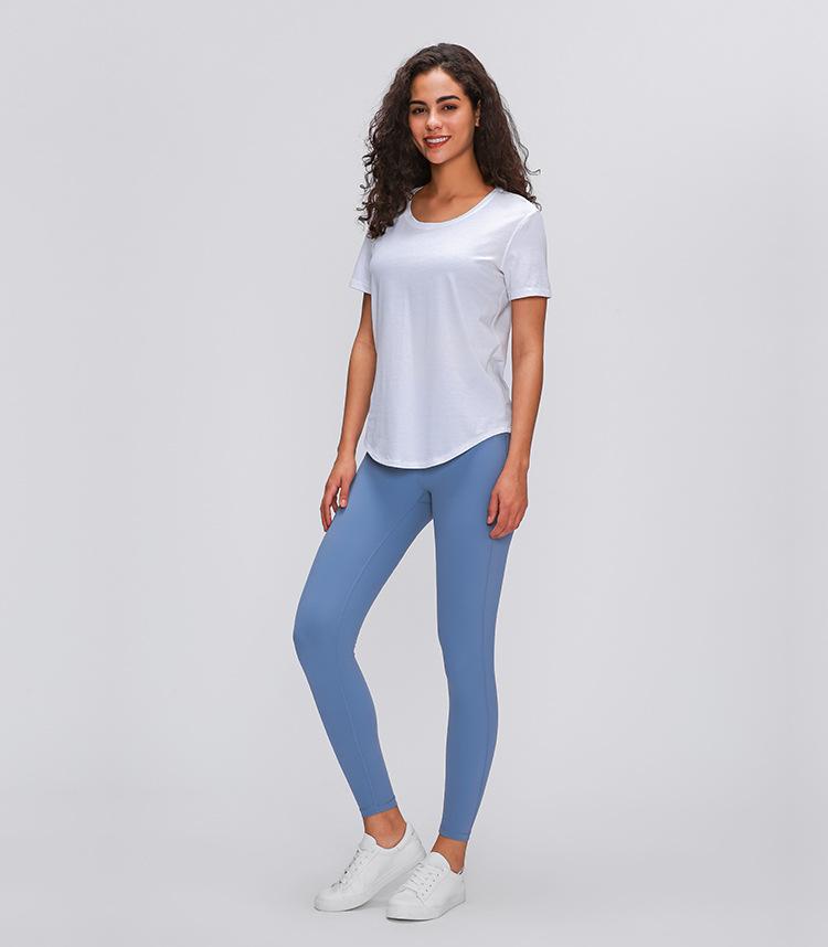 A stylish Cotton Yoga Exercise Workout T-shirt for women, featuring short sleeves and a hip-length design, perfect for workouts and casual wear.