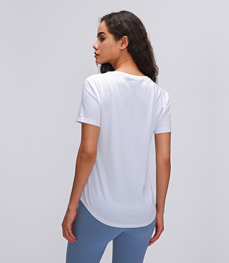 A stylish Cotton Yoga Exercise Workout T-shirt for women, featuring short sleeves and a hip-length design, perfect for workouts and casual wear.