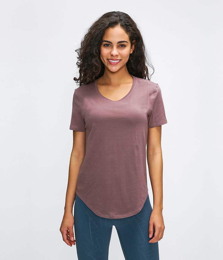 A stylish Cotton Yoga Exercise Workout T-shirt for women, featuring short sleeves and a hip-length design, perfect for workouts and casual wear.