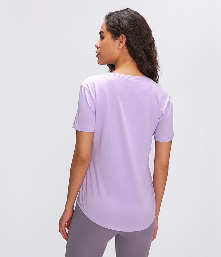 A stylish Cotton Yoga Exercise Workout T-shirt for women, featuring short sleeves and a hip-length design, perfect for workouts and casual wear.