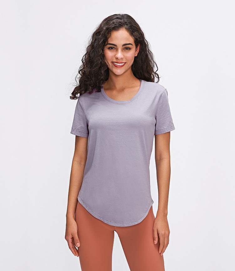 A stylish Cotton Yoga Exercise Workout T-shirt for women, featuring short sleeves and a hip-length design, perfect for workouts and casual wear.