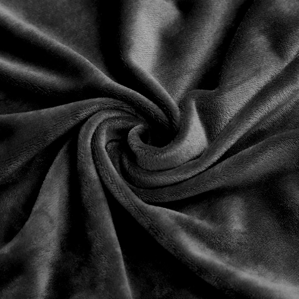 High stretch black sofa cover protector designed for 4-seater couches, featuring a plush texture and anti-slip design for comfort and durability.