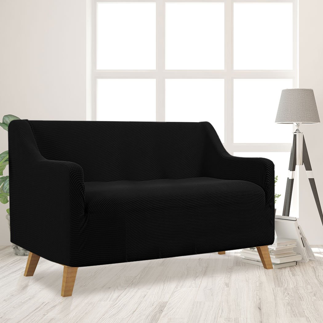 Black Couch Stretch Sofa Lounge Cover Protector Slipcover for 2 Seater, showcasing its high stretch material and well-stitched edges.