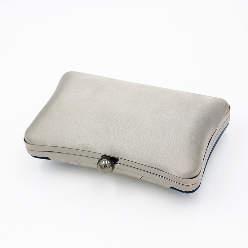 Criss Cross Satin Evening Bag in Velvet Blue, featuring a stylish pillow design and criss-cross decoration, perfect for parties and special occasions.