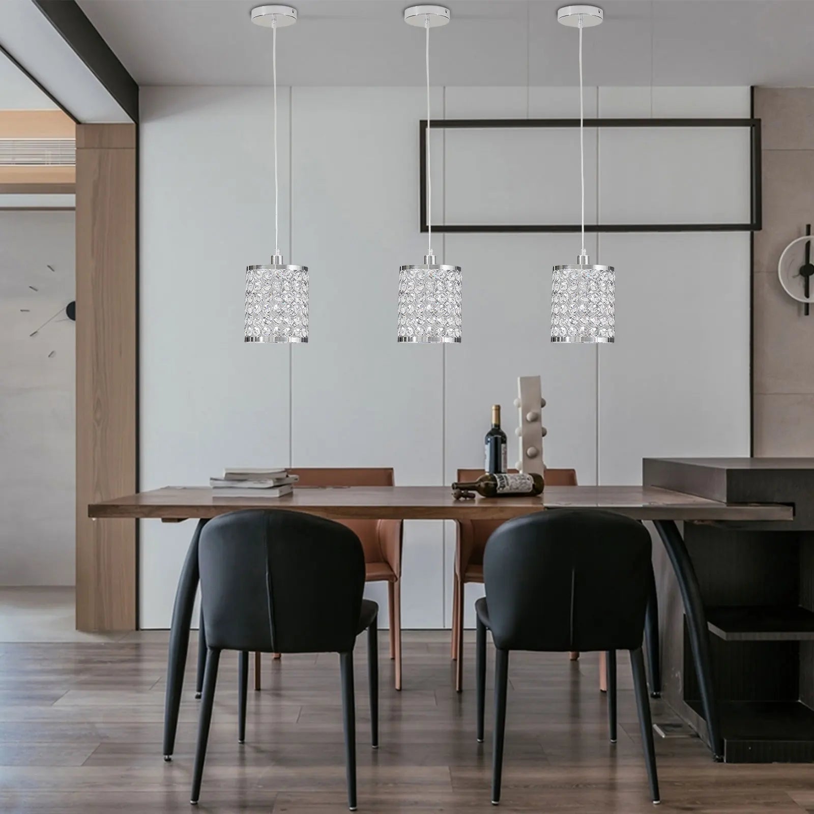 Elegant crystal pendant light with adjustable cord, perfect for modern kitchen islands.