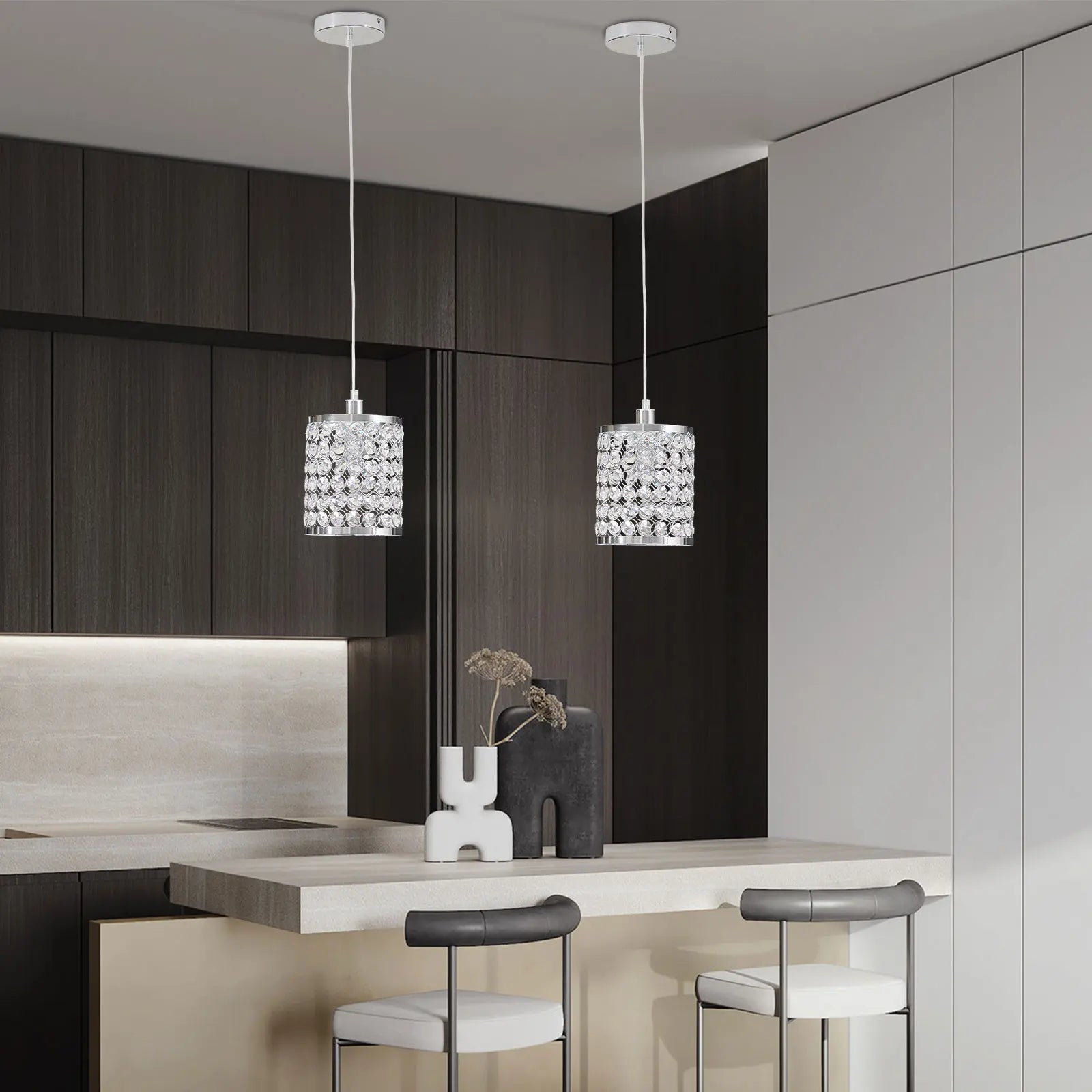 Elegant crystal pendant light with adjustable cord, perfect for modern kitchen islands.