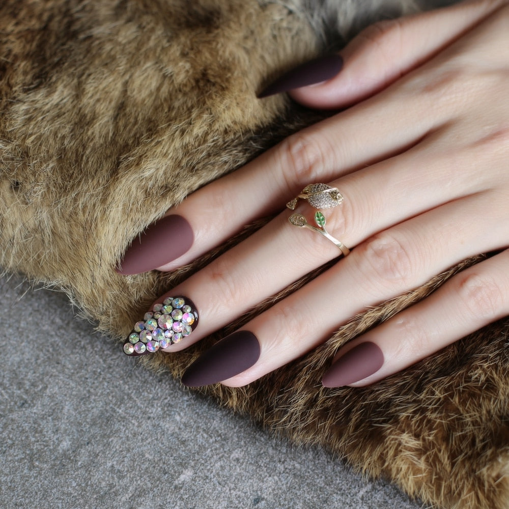 Dark coffee full stiletto press-on nails displayed in a stylish arrangement, showcasing their elegant design and color.