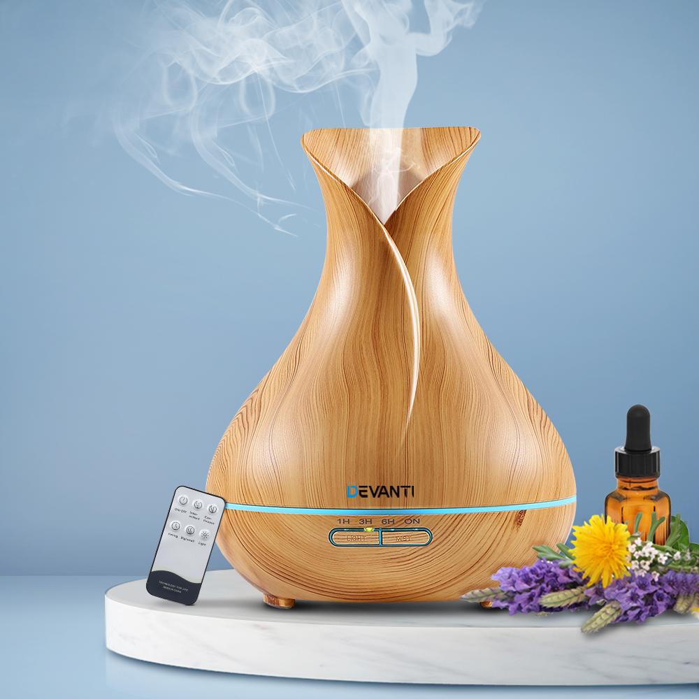 Devanti 400ml 4-in-1 Aroma Diffuser in light wood finish, showcasing its elegant design and remote control feature.