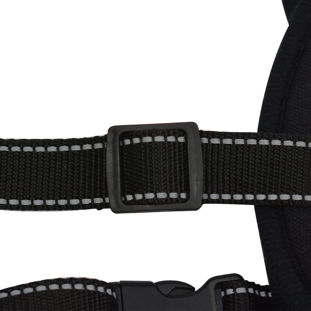 Dog Adjustable Harness in black with meshed surface and integrated hand grip, designed for comfort and control during training.