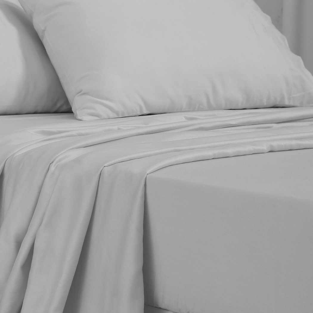 DreamZ 4 Pcs Natural Bamboo Cotton Bed Sheet Set in King Size Grey, featuring a fitted sheet, flat sheet, and two pillowcases, showcasing a soft sateen finish.