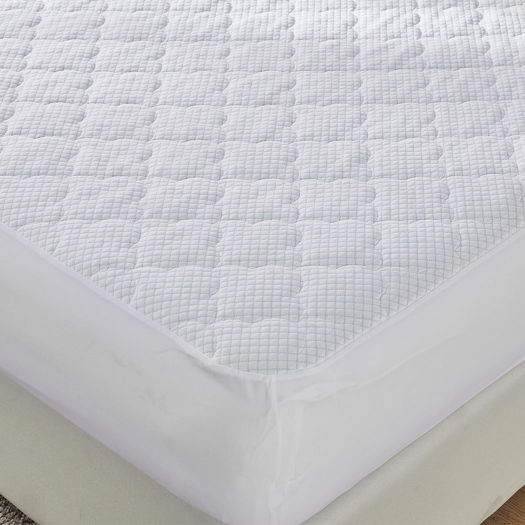 Dreamz Mattress Protector Topper in white, showcasing cool fabric and plush pillowtop design, perfect for king-sized beds.