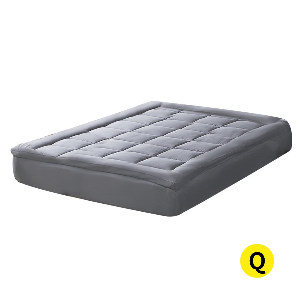 Dreamz Mattress Topper made of bamboo fibre with a plush pillowtop design, featuring a charcoal color and elastic skirt for a secure fit.