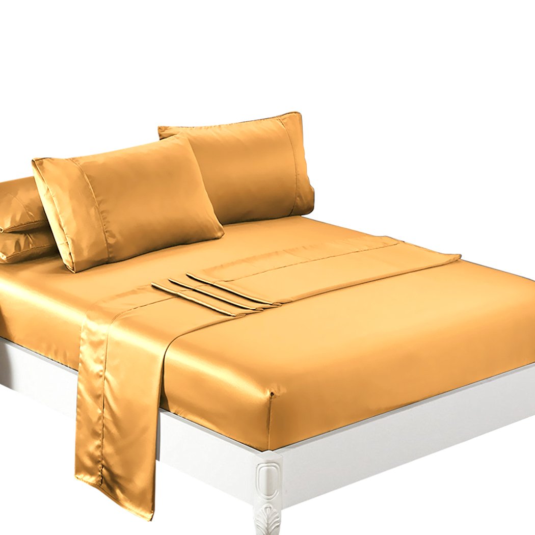 Golden satin sheeted bed.