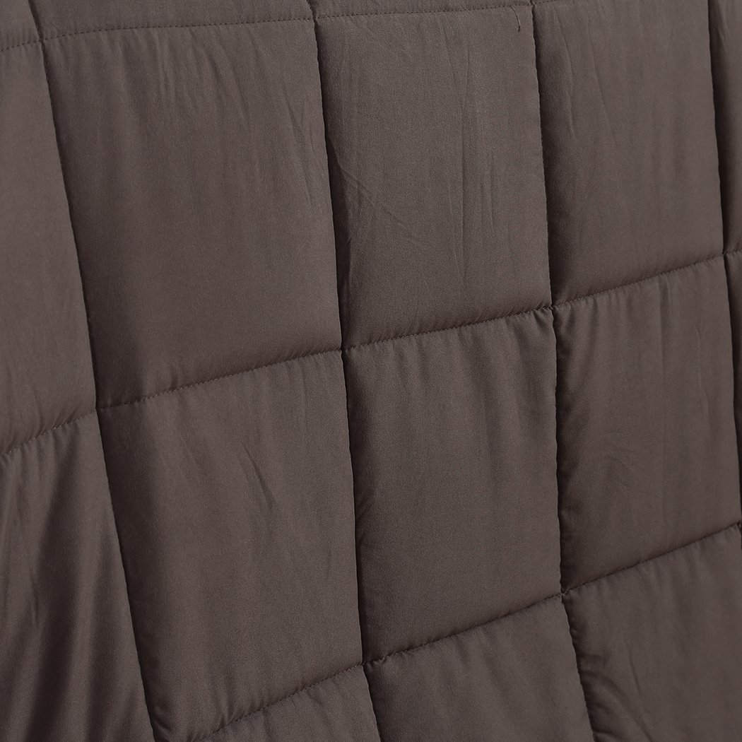 DreamZ Weighted Blanket in mink color, featuring a soft polyester exterior and glass bead filling for deep relaxation.