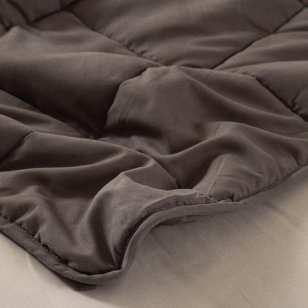 DreamZ Weighted Blanket in mink color, featuring a soft polyester exterior and glass bead filling for deep relaxation.