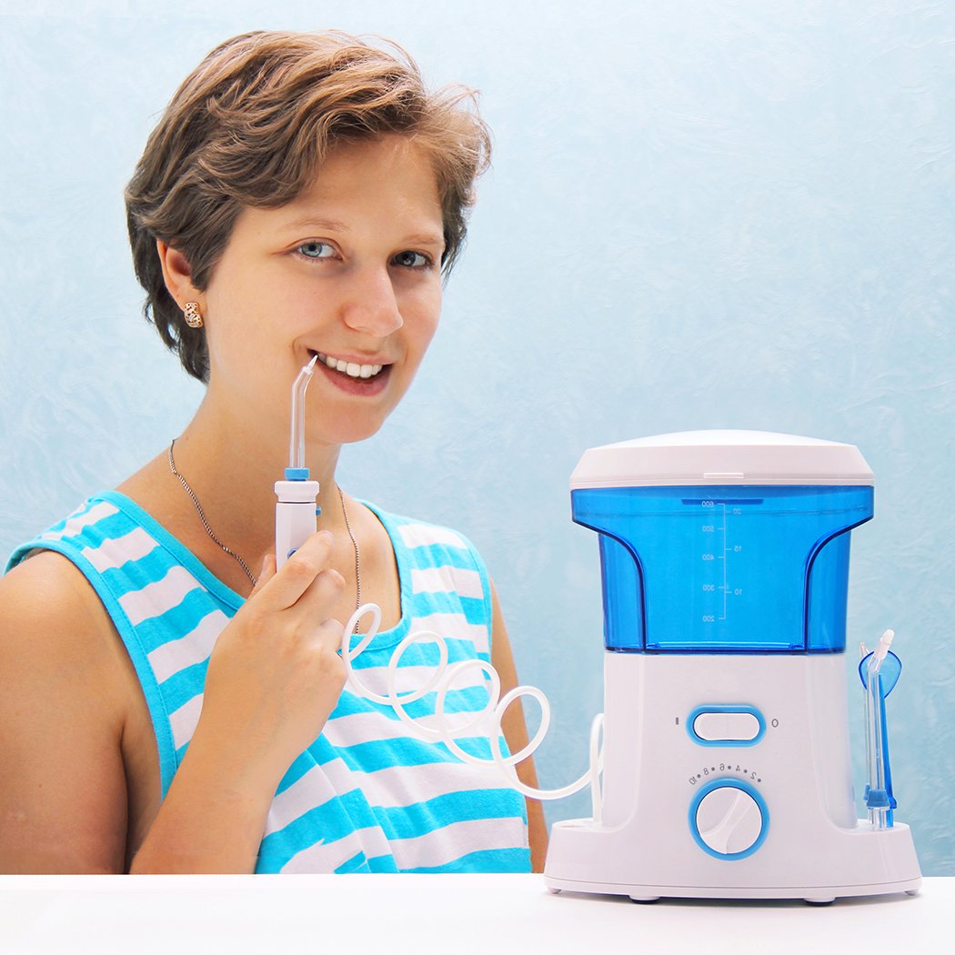 Electric Oral Irrigator Tooth Cleaner Kit with 7 tips, designed for effective dental care and plaque removal.