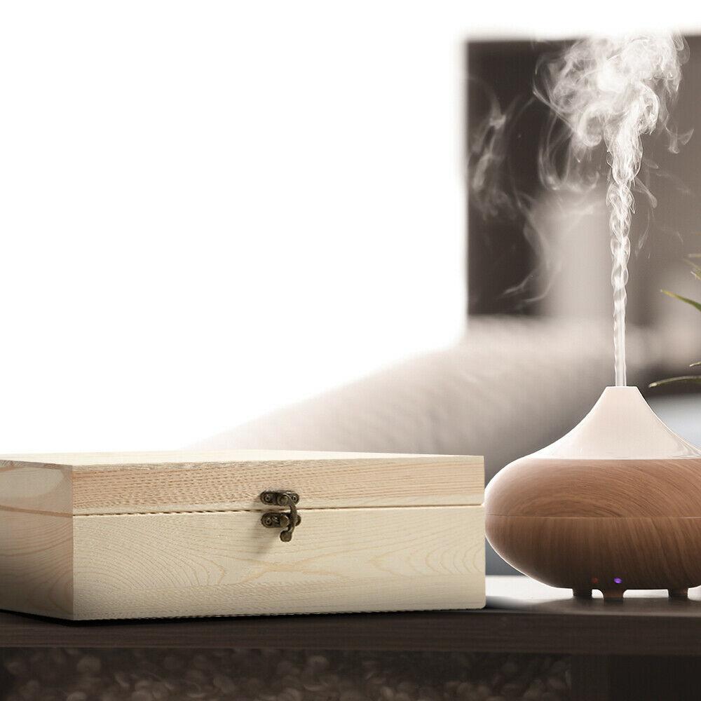 Wooden essential oil storage box with 25 slots for bottles, featuring a removable divider and sturdy construction.