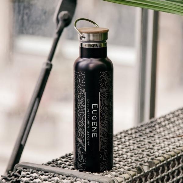 Eugene Oregon Map Bottle with Bamboo Top in Matte Black, showcasing custom engraving and sleek design.