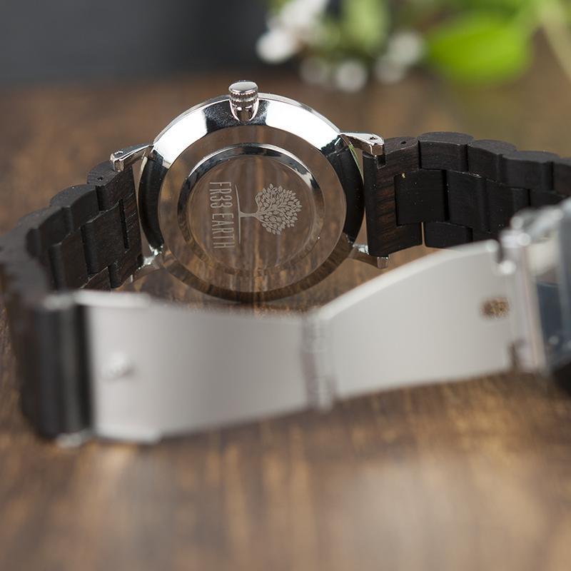 Evening Watch featuring a stainless steel case and a unique wooden band, showcasing its stylish design suitable for both men and women.