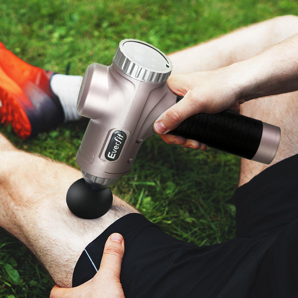 Everfit Massage Gun with six interchangeable heads for customized vibration therapy, featuring a sleek gold design and LCD display.