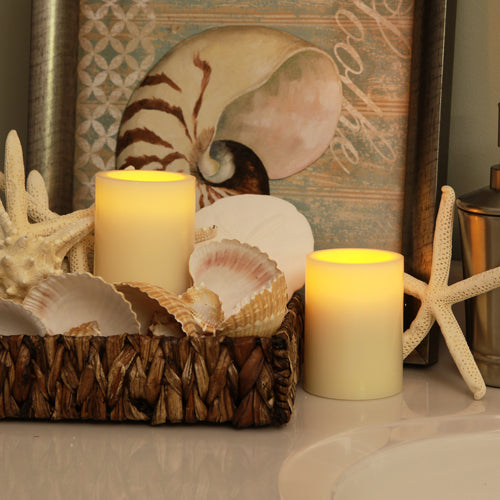 Flameless 3 x 4 Flat Top Wax Pillar Candle in a cozy indoor setting, showcasing its realistic wax finish and warm glow.