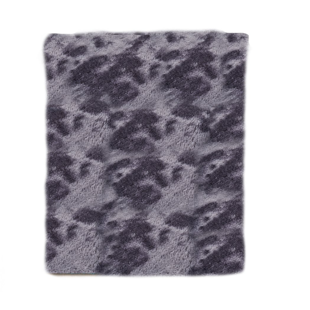 A large tie-dyed shaggy rug in midnight colors, showcasing a soft 35mm high pile and a non-slip silicone bottom, perfect for home decor.