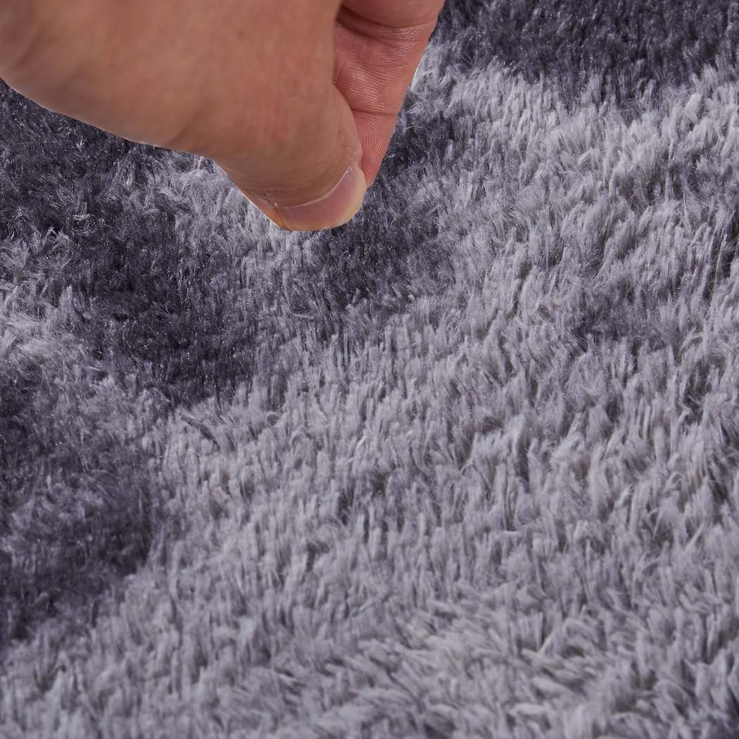 Soft shaggy tie-dyed floor rug in midnight city design, showcasing its plush texture and vibrant colors.