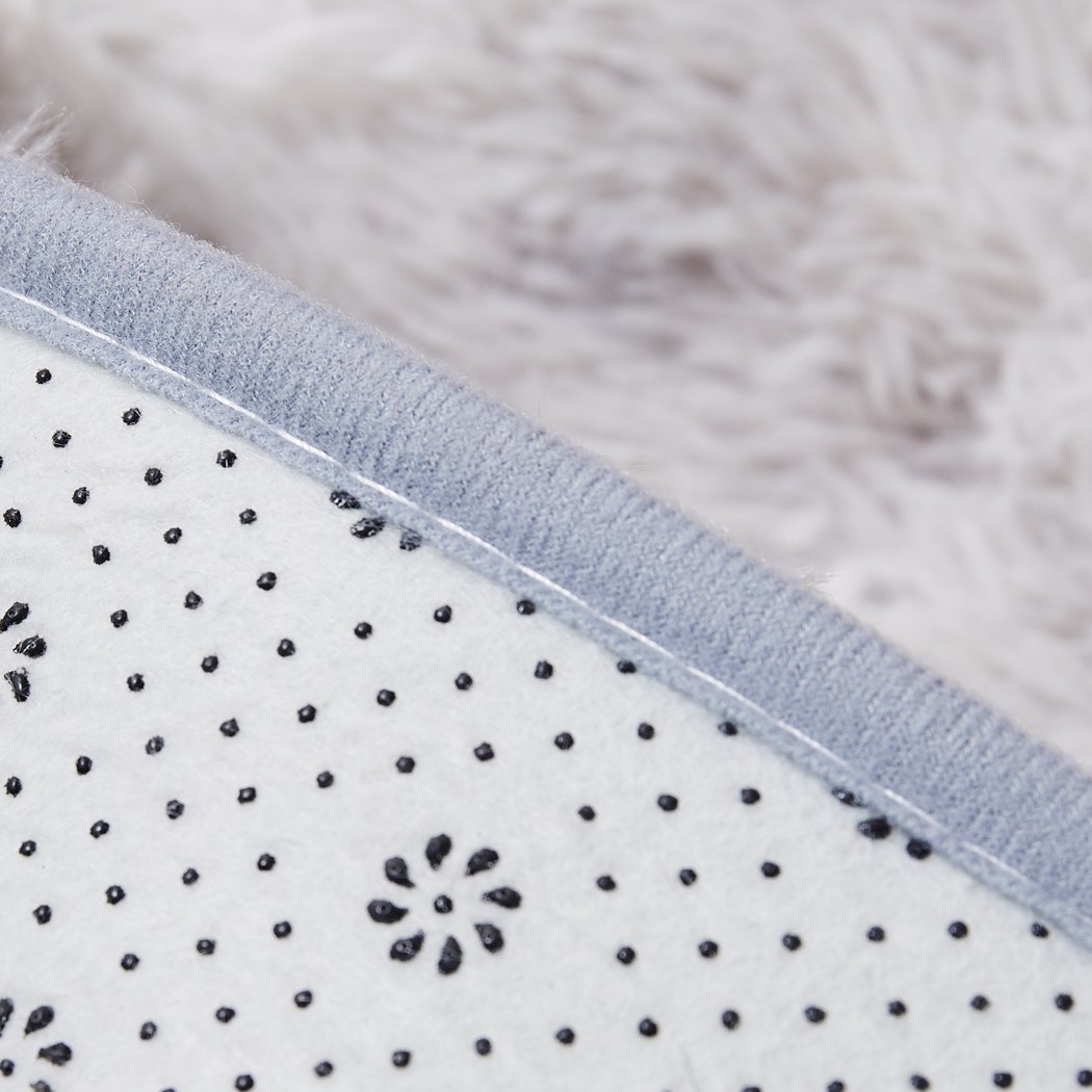 A large tie-dyed shaggy rug measuring 140x200cm, featuring a soft, plush surface and a non-slip silicone bottom, perfect for home decor.