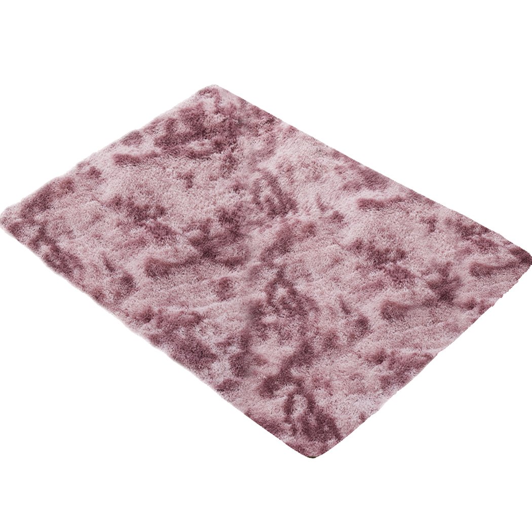 A large tie-dyed shaggy floor rug with a soft texture, showcasing vibrant colors and a non-slip silicone bottom, perfect for home decor.