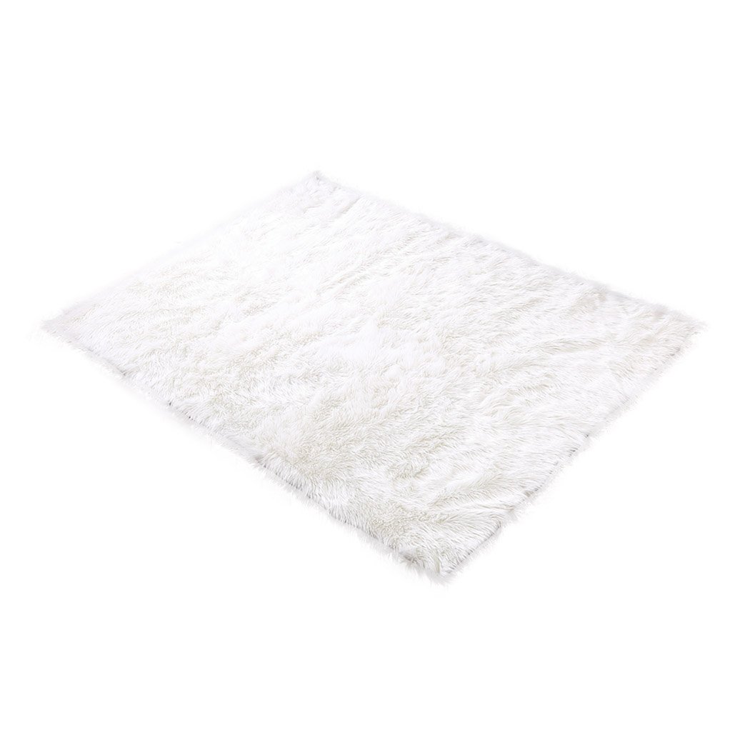 Luxurious white sheepskin shaggy rug with a plush texture, perfect for enhancing home decor in living rooms and bedrooms.