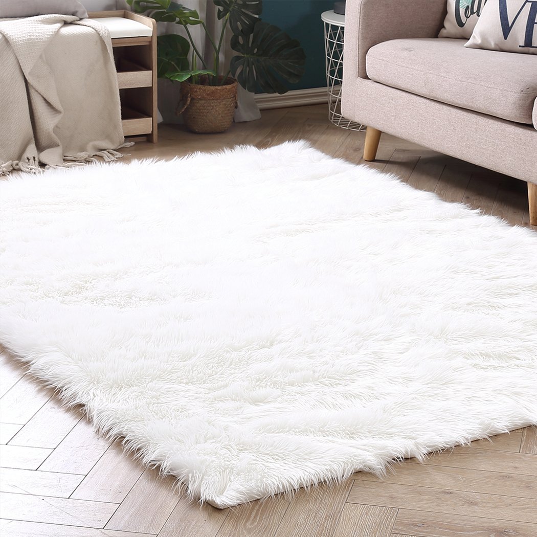 Luxurious white sheepskin shaggy rug with a plush texture, perfect for enhancing home decor in living rooms and bedrooms.