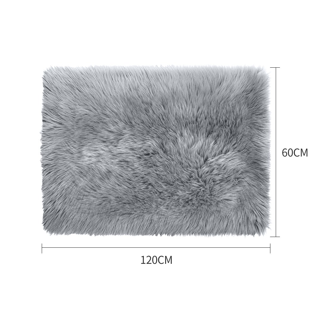 Luxurious grey sheepskin shaggy rug with a plush 60-70mm pile, perfect for enhancing any living space.