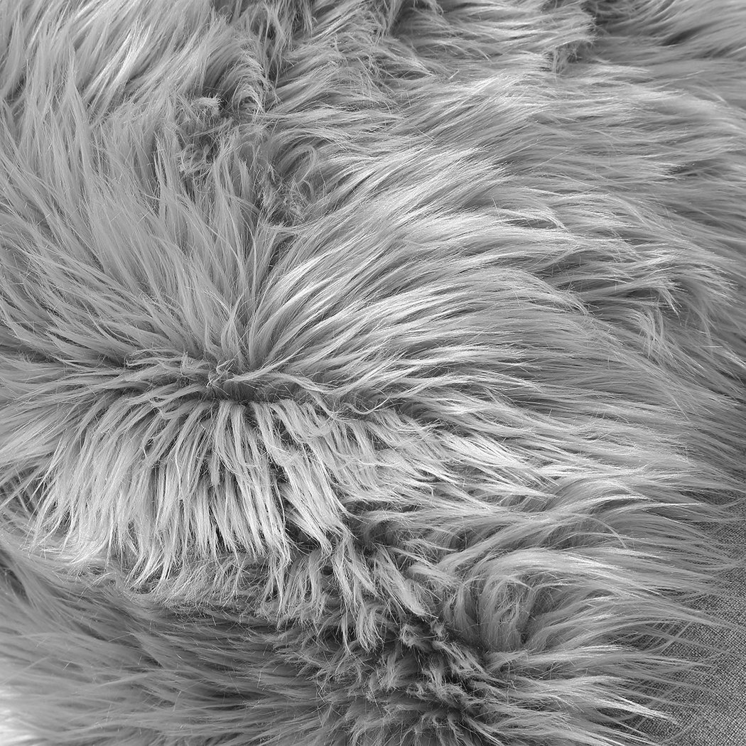 Luxurious grey sheepskin shaggy rug with a plush 60-70mm pile, perfect for enhancing any living space.