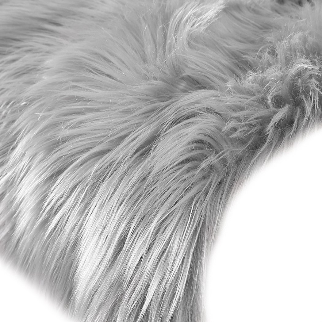 Luxurious grey sheepskin shaggy rug with a plush 60-70mm pile, perfect for enhancing any living space.