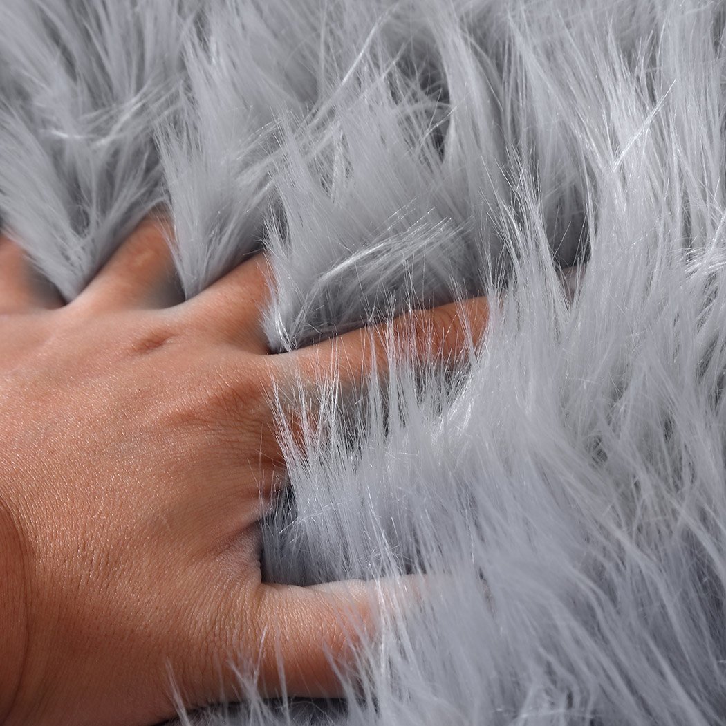 Luxurious grey sheepskin shaggy rug with a plush 60-70mm pile, perfect for living rooms and bedrooms.