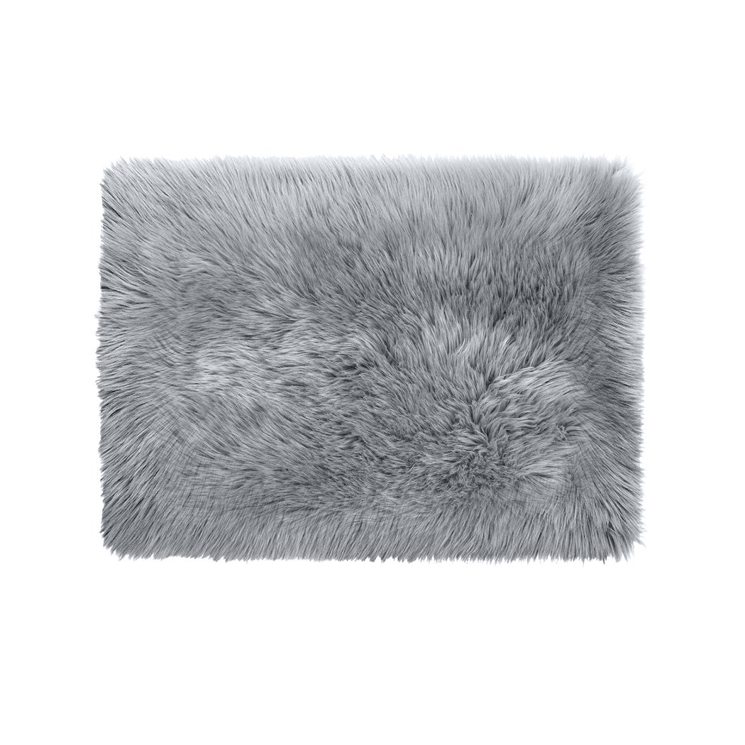 Luxurious grey sheepskin shaggy rug with a plush 60-70mm pile, perfect for enhancing any living space.