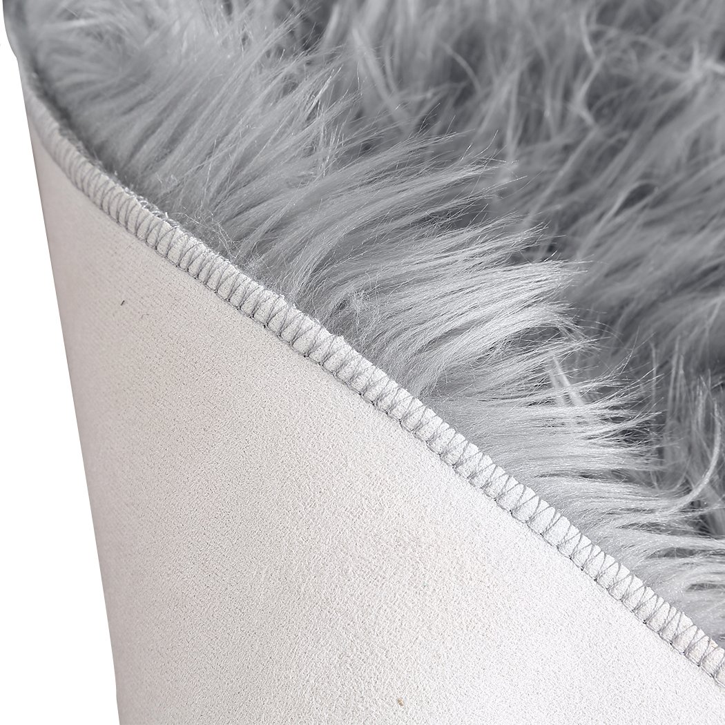 Luxurious grey sheepskin shaggy rug with a plush 60-70mm pile, perfect for enhancing any living space.