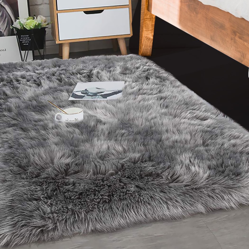 Luxurious grey sheepskin shaggy rug with a plush 60-70mm pile, perfect for enhancing any living space.