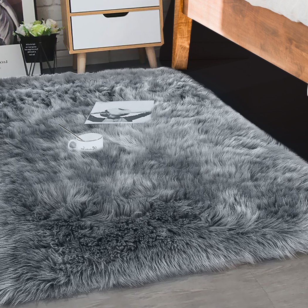 Luxurious dark grey sheepskin shaggy rug measuring 160x230 cm, perfect for bedrooms and living rooms.