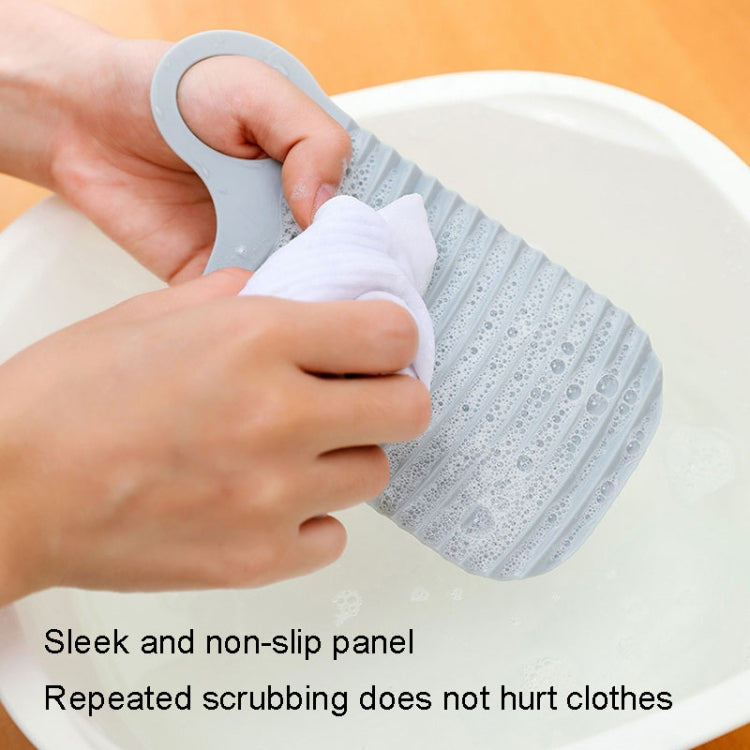 Foldable Soft Silicone Laundry Board in grey, featuring a smooth surface and convenient hanging holes for easy storage.