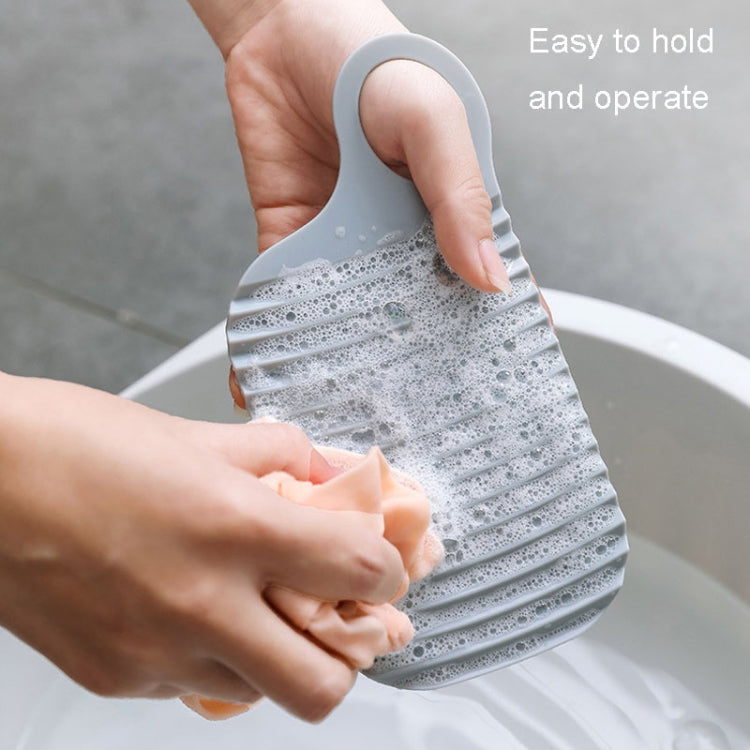 Foldable Soft Silicone Laundry Board in grey, featuring a smooth surface and convenient hanging holes for easy storage.